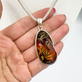 Carved Amber Free Shape Pendant Sterling Silver