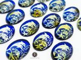 Blue Amber Engraved Dolphins Oval Shape Cabochons