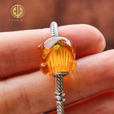 Cognac Color Amber Carved Whale Charm Bead