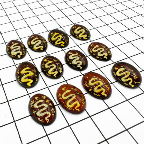 Cherry Amber Engraved Snakes Oval Shape Cabochon