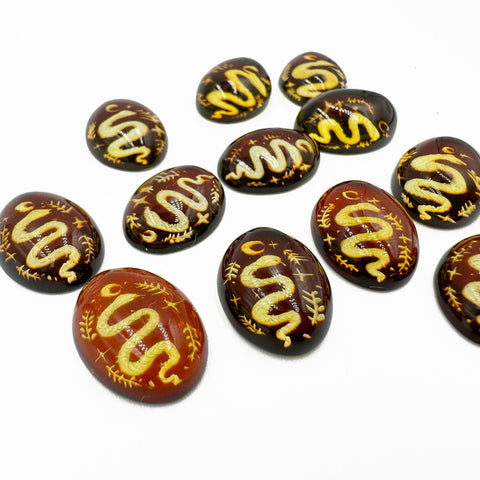 Cherry Amber Engraved Snakes Oval Shape Cabochon