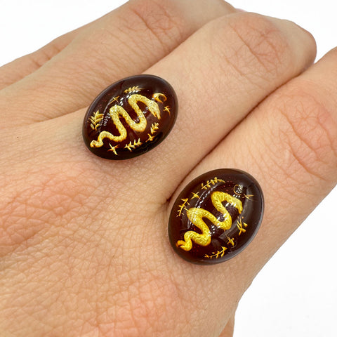 Cherry Amber Engraved Snakes Oval Shape Cabochon