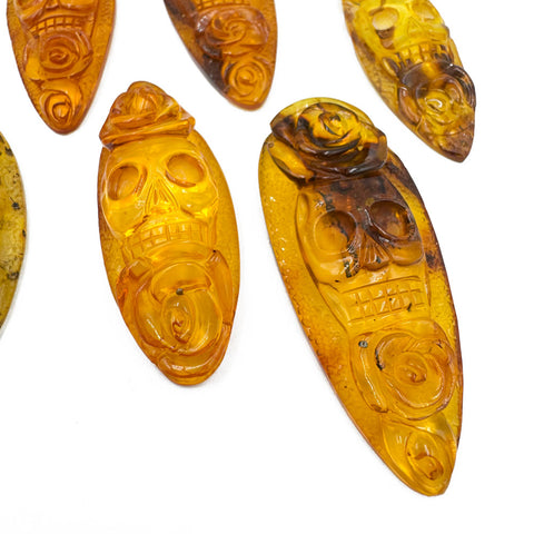 Cognac Amber Carved Roses And Skull Cabochons