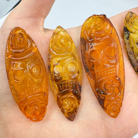 Cognac Amber Carved Roses And Skull Cabochons