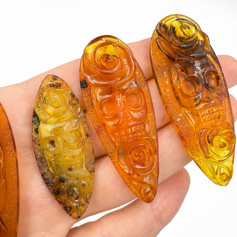Cognac Amber Carved Roses And Skull Cabochons