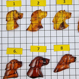 Cognac Amber Carved Dogs Cabochon