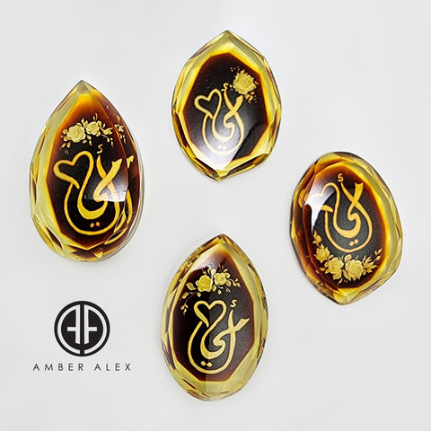 Two Tone Amber Engraved 'Mother' in Arabic Faceted Oval Shape Cabochons