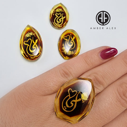 Two Tone Amber Engraved 'Mother' in Arabic Faceted Oval Shape Cabochons