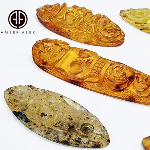 Cognac & Fossil Amber Carved Roses And Skull Cabochons