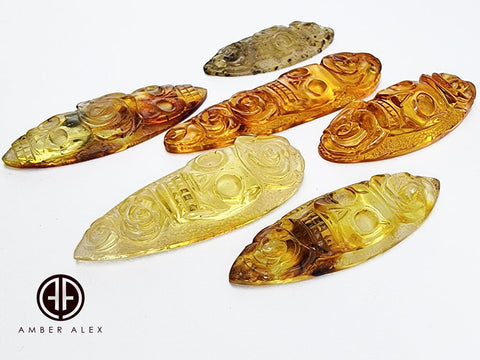 Cognac & Fossil Amber Carved Roses And Skull Cabochons