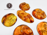 Cognac Amber Carved Faces Cabochons
