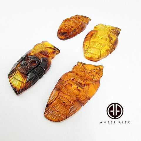 Cognac Amber Carved Owl with Skull Cabochons