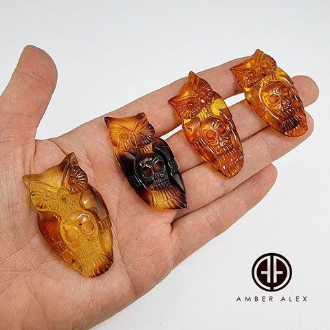 Cognac Amber Carved Owl with Skull Cabochons