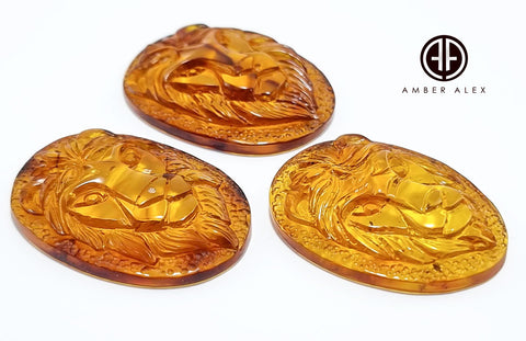 Cognac Amber Carved Lion Cabochon