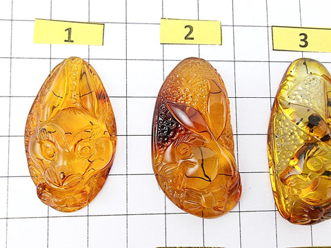 Fossil & Cognac Amber Carved Rabbits Cabochons