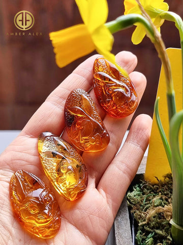 Fossil & Cognac Amber Carved Rabbits Cabochons