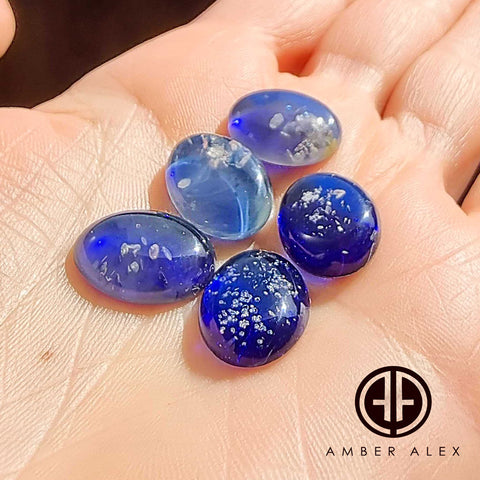 Blue Amber Oval Shape Calibrated Cabochons