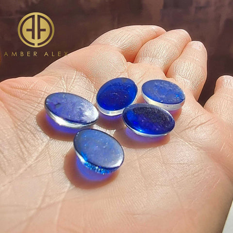 Blue Amber Oval Shape Calibrated Cabochons