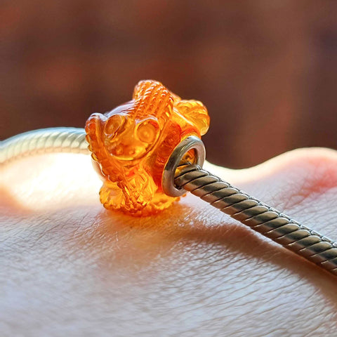 Cognac Amber Carved Snakes Charm Bead