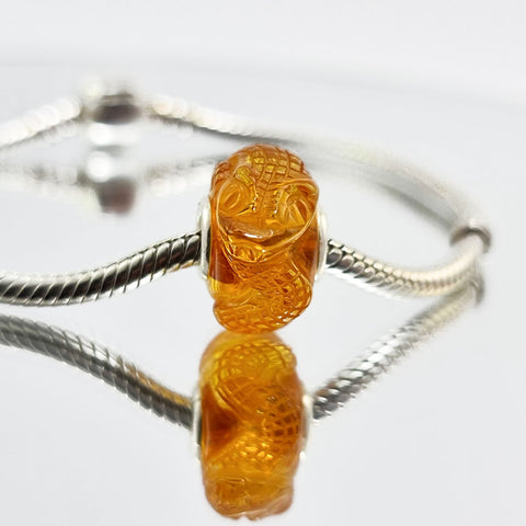 Cognac Amber Carved Snakes Charm Bead