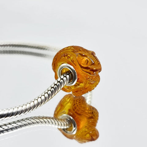 Cognac Amber Carved Snakes Charm Bead