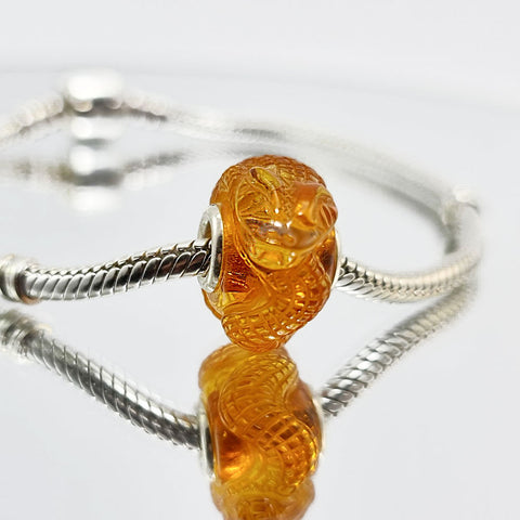 Cognac Amber Carved Snakes Charm Bead