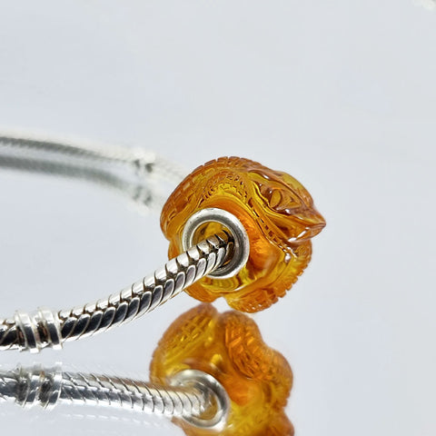 Cognac Amber Carved Snakes Charm Bead