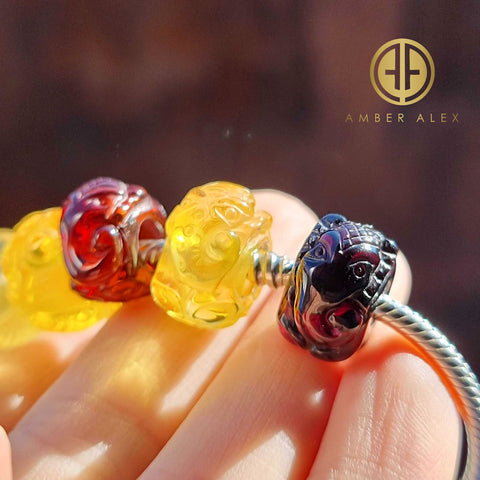 Multi-Color Amber Carved Elephant Charm Bead