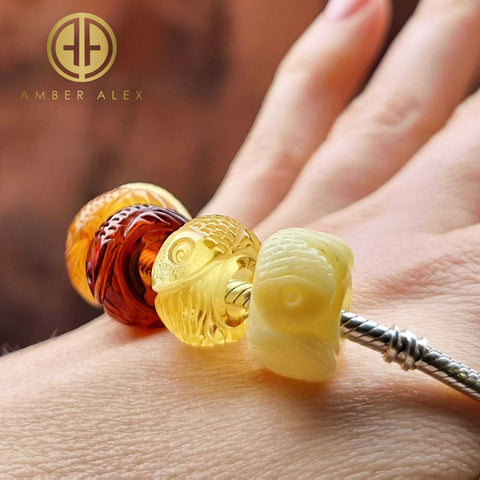 Multi-Color Amber Carved Fish Charm Bead