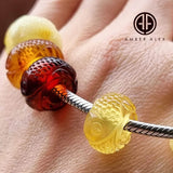 Multi-Color Amber Carved Fish Charm Bead