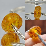 Multi-Color Amber Carved Fish Charm Bead