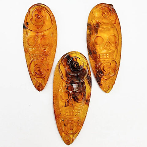 Cognac Amber Carved Roses And Skull Cabochons