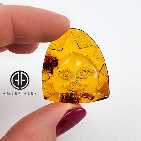 Cognac Amber Carved Sun Cabochon