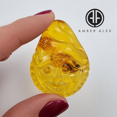 Cognac Amber Carved Sun Cabochon