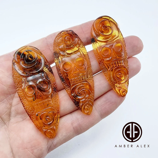 Cognac Amber Carved Roses And Skull Cabochons