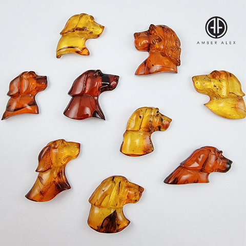 Cognac Amber Carved Dogs Cabochon